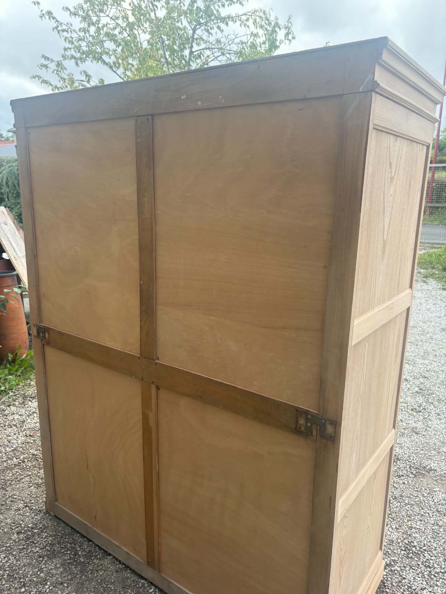 Large antique wardrobe in raw wood