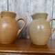 Pair antique cnp village beige & cream stoneware pitchers vintage