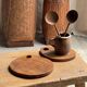Average circular teak monoxyle chopping board with handle 26 x 18.