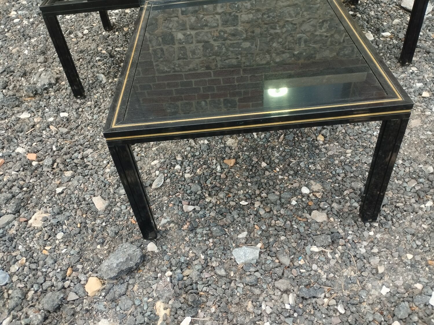 Vintage metal coffee table with glass top.