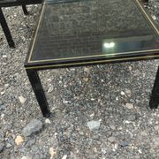 Vintage metal coffee table with glass top.