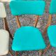 Set of 4 vintage chairs in wood and imitation blue leather dating from the 50s. Wooden structure. Seat and backrest in imitation leather 2 mint green and 2 yellow. Seating dimension: 46 cm. Good state of conservation, some traces of wear.