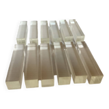 Twelve old lucite knife holders