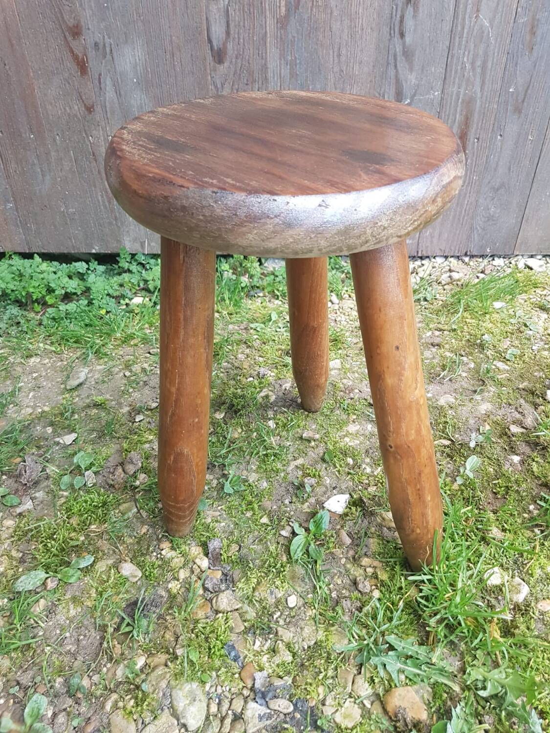 Old vintage wooden tripod milking stool