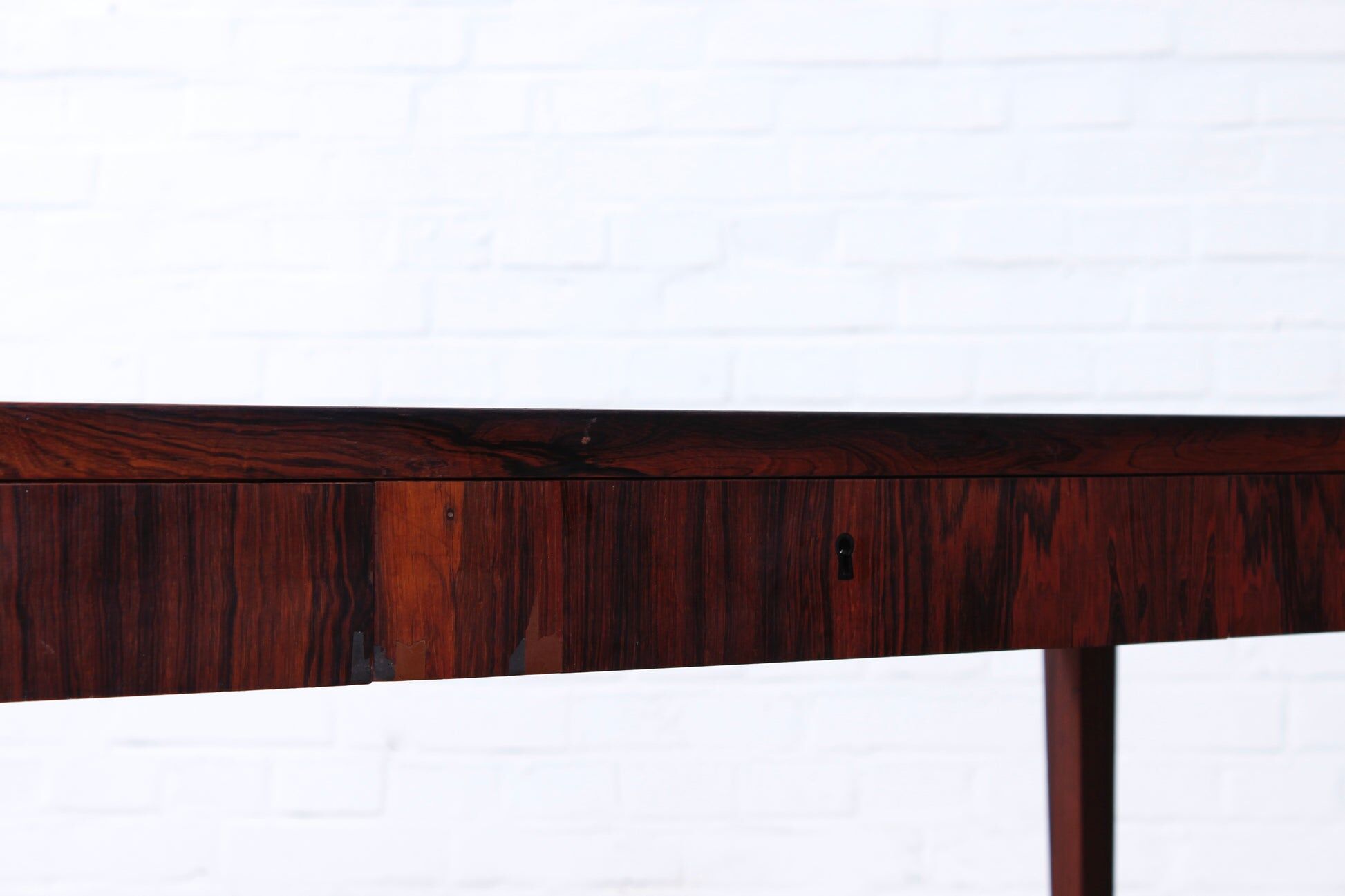 Minimalist rosewood desk by Riis Andersen