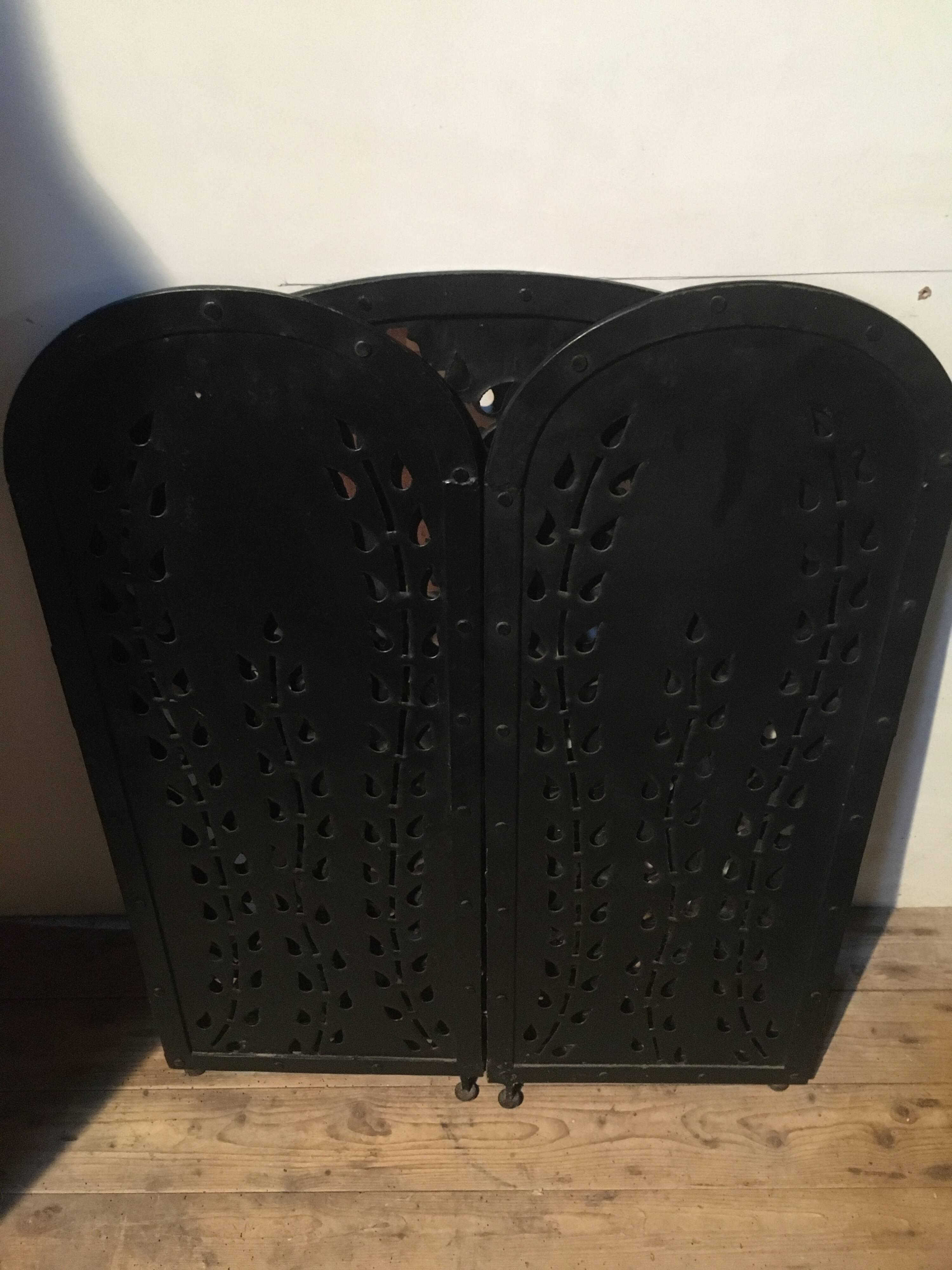 Wrought and cut metal fire screen