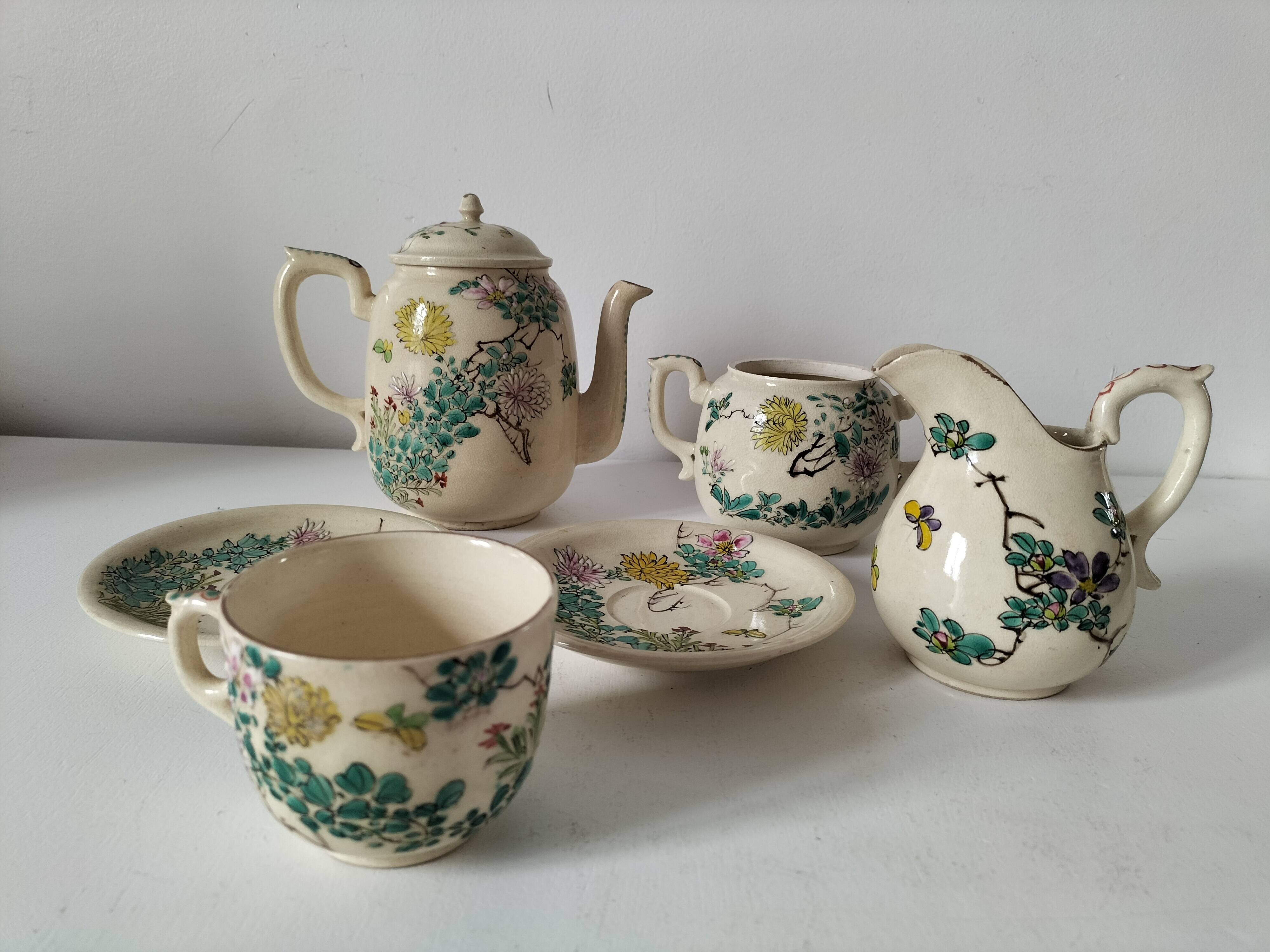 Japanese-style tea set in cracked earthenware with chrysanthemum flowers