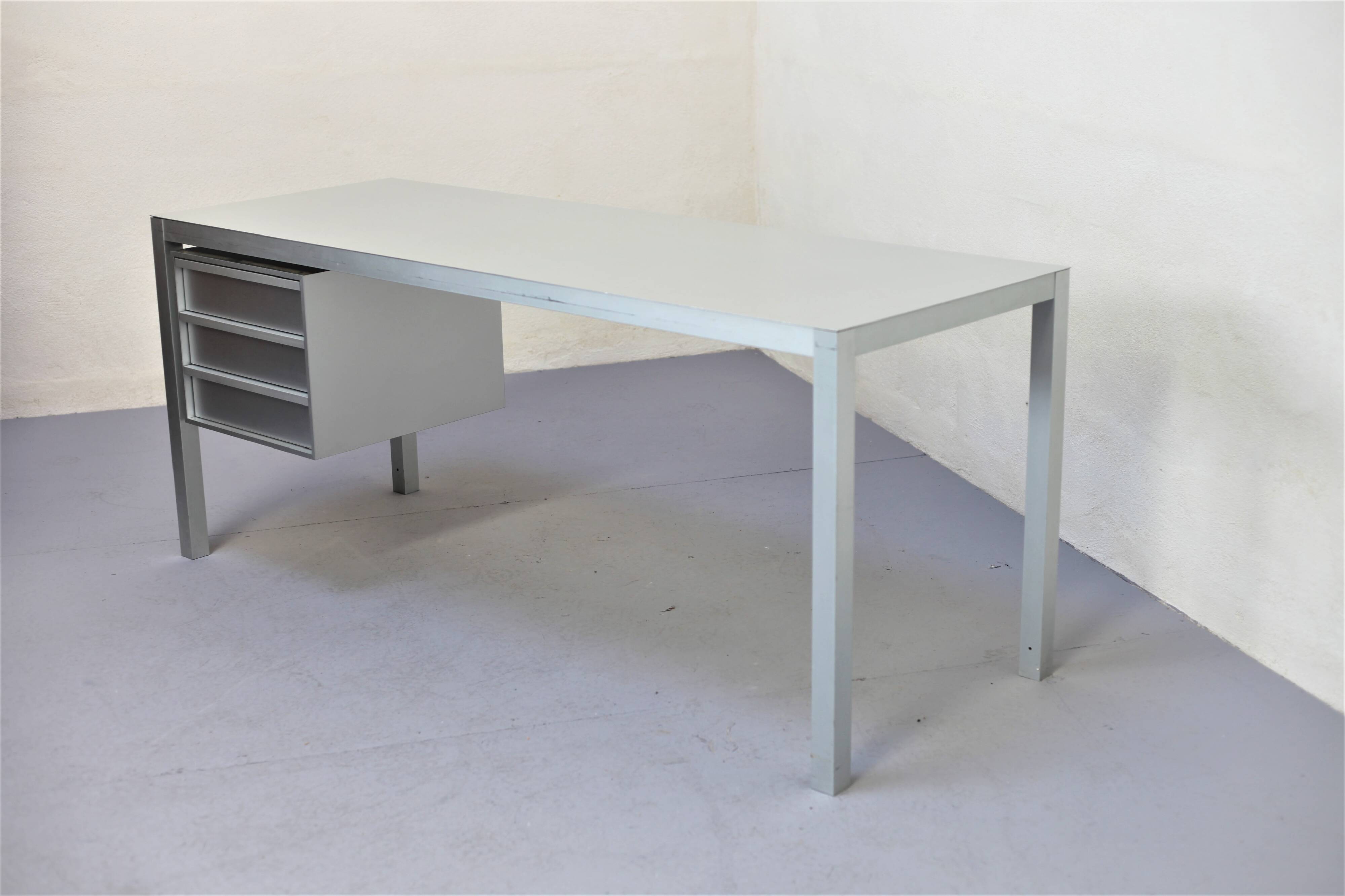 Brushed aluminum desk by MDF Italia