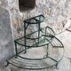 Antique half-moon metal plant stand