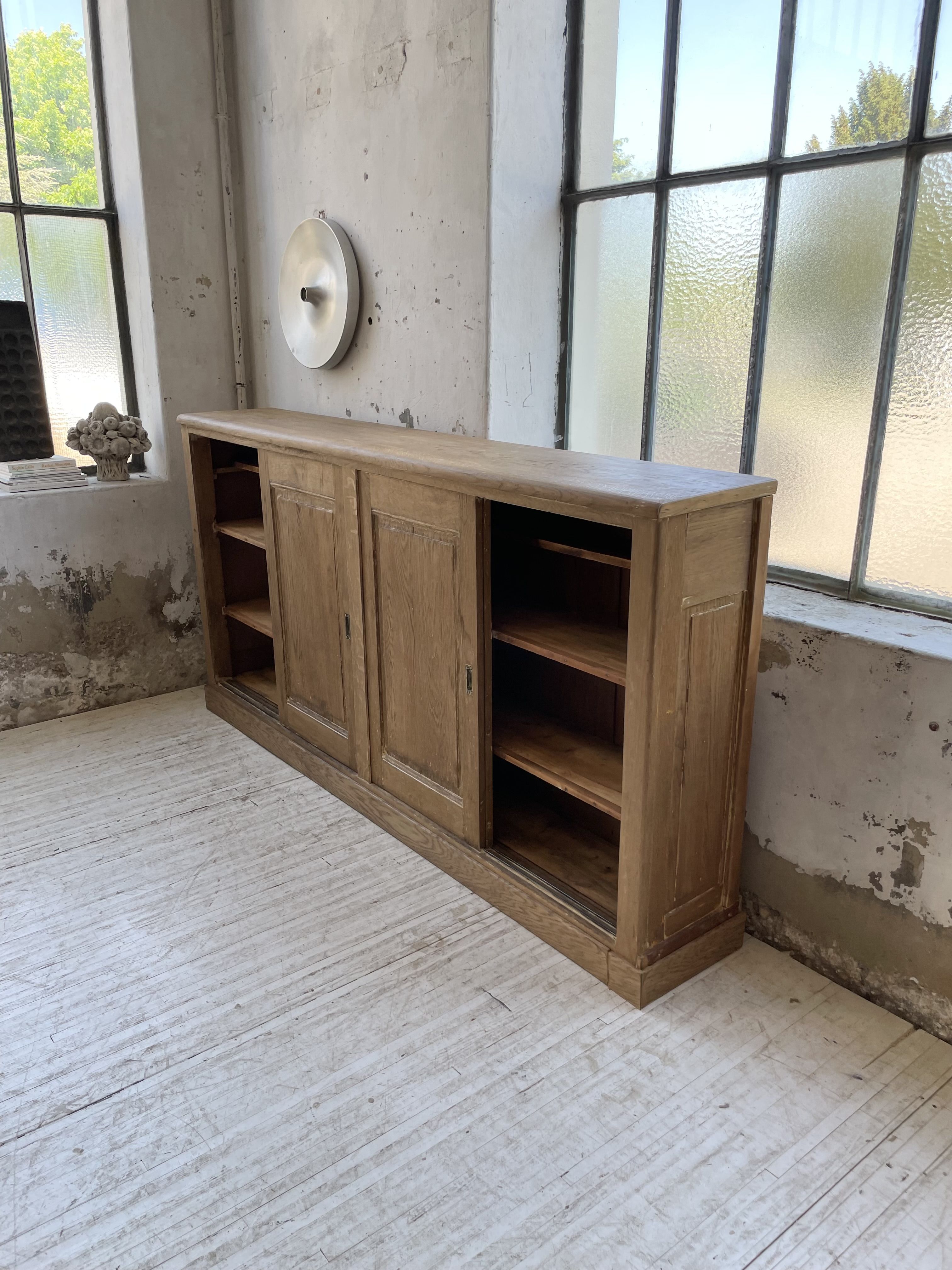Large row of solid oak loom sliding doors