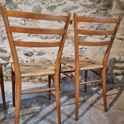 Set of 4 mid-century Italian dining chairs with woven seats, circa 1950–1970.