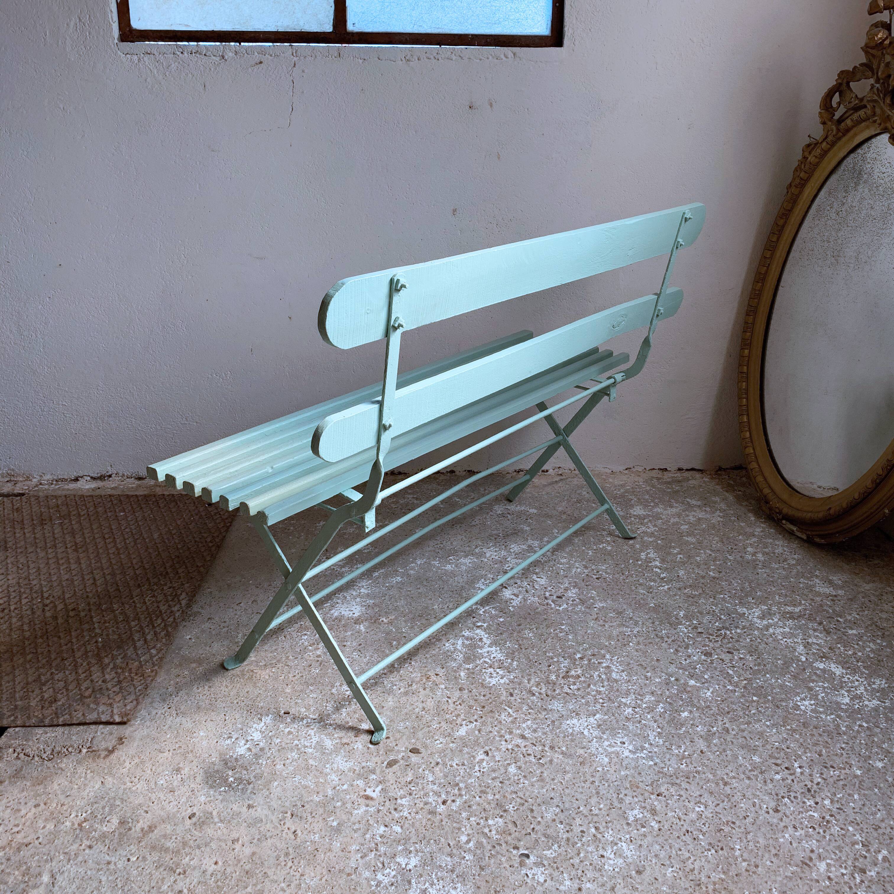 Former folding garden bench with wooden and metal slats