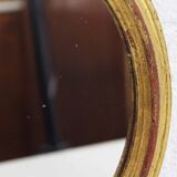 Golden oval mirror