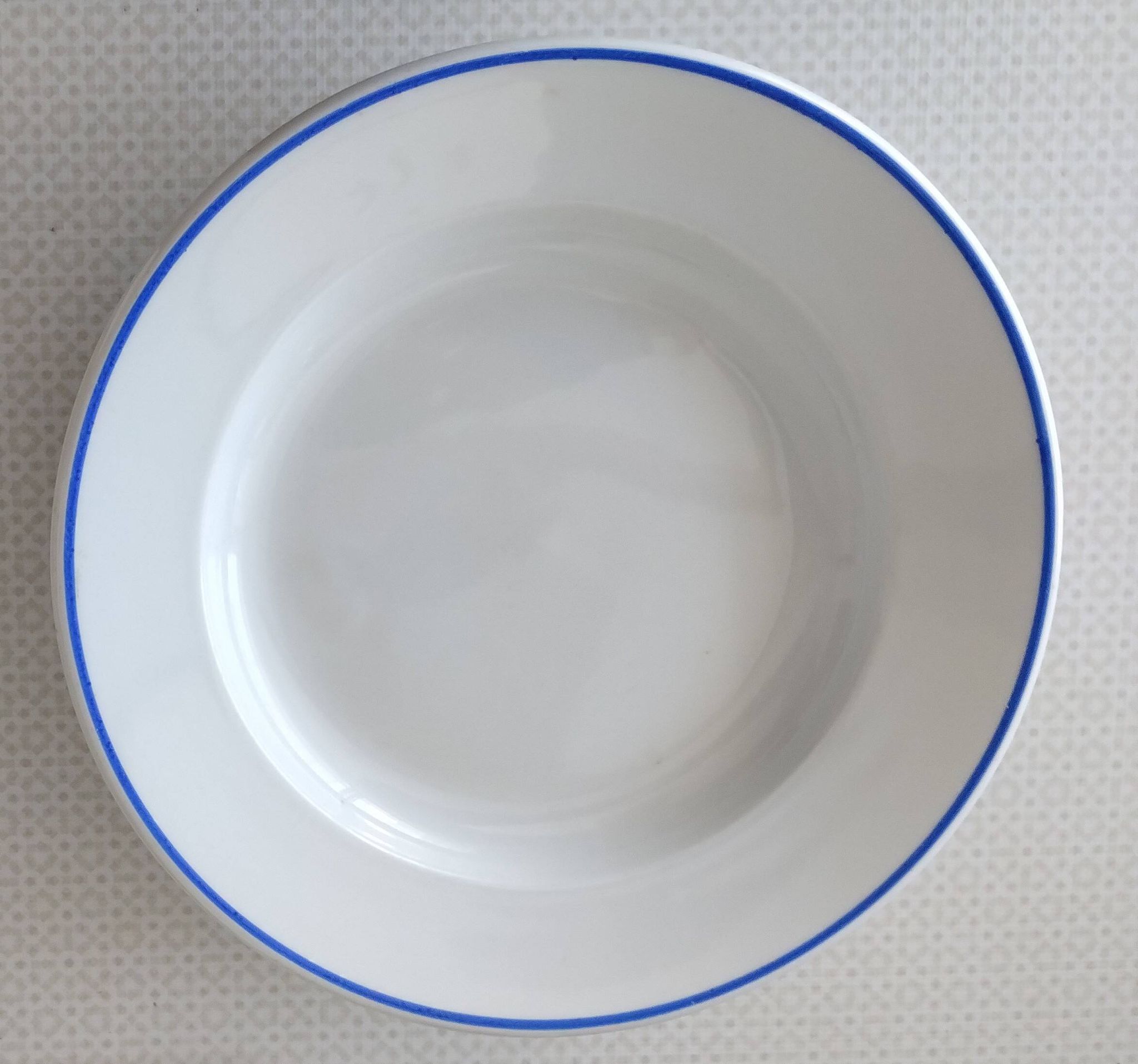 3 Pillivuyt white porcelain dinner plates with blue edging.
