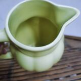 Yellow pitcher in earthenware