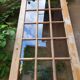 Old wooden door glazed with small tiles