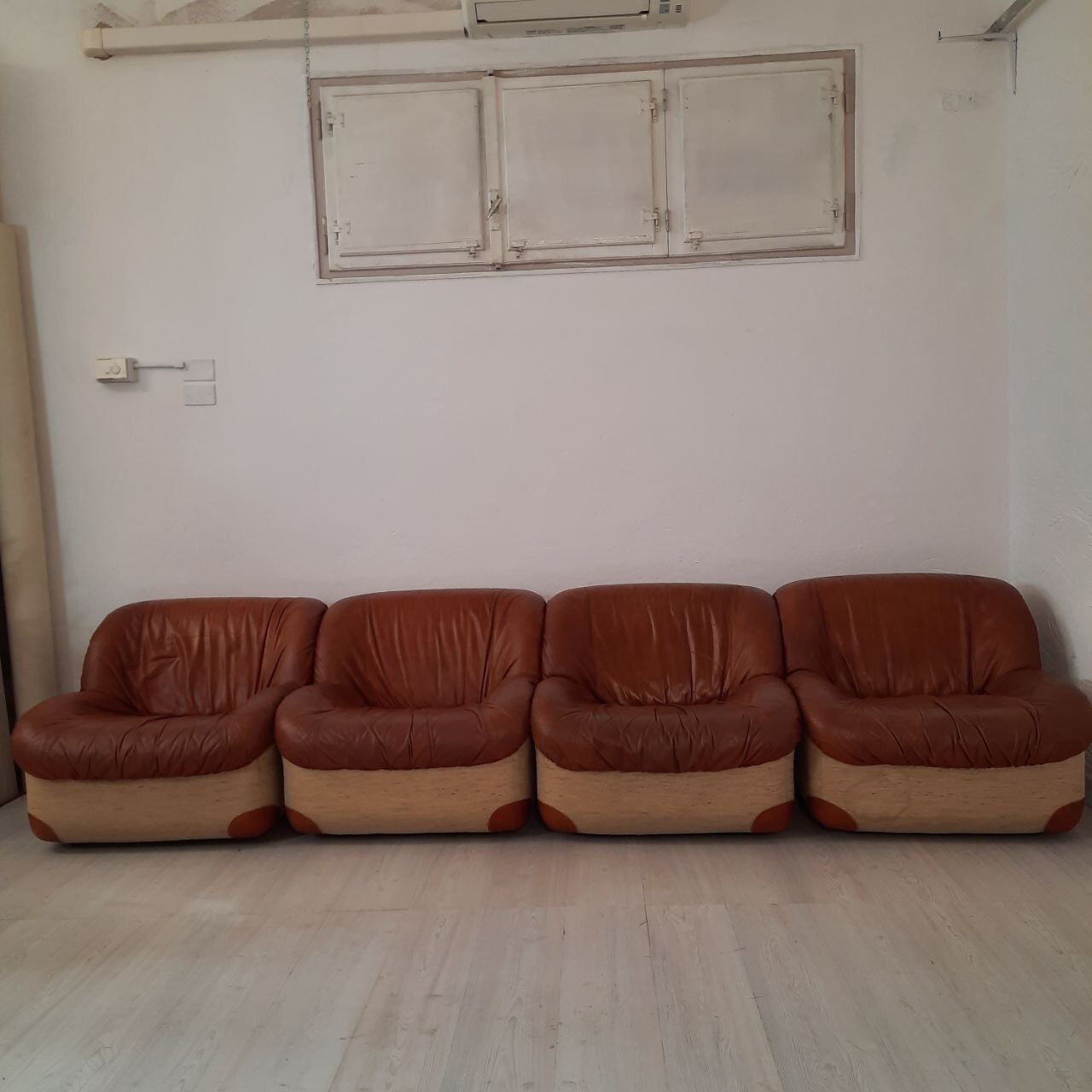 Four vintage armchairs, leather and fabric, 70s