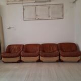 Four vintage armchairs, leather and fabric, 70s