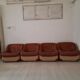 Four vintage armchairs, leather and fabric, 70s