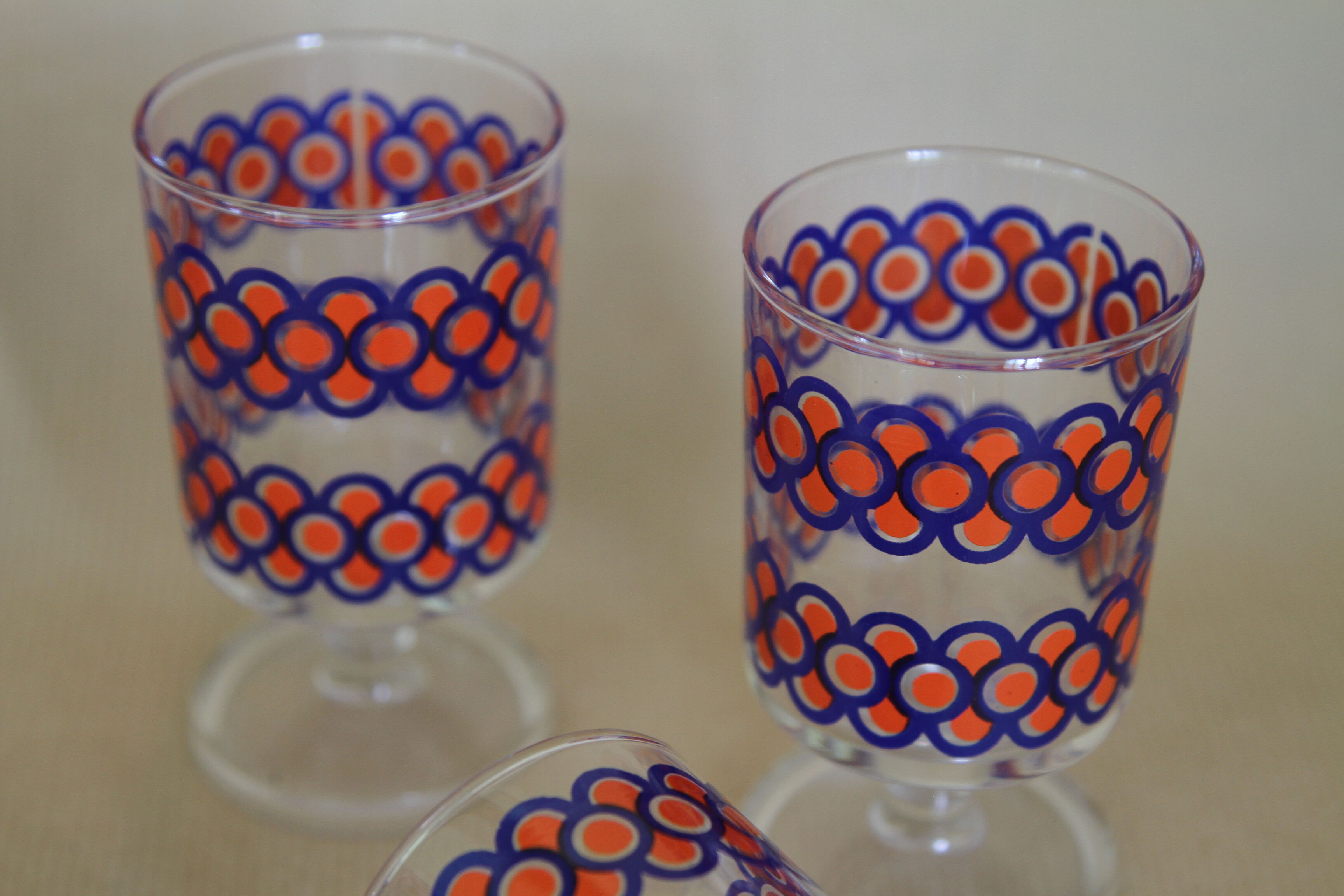 Blue and orange patterned foot glasses set