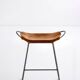 Contemporary kitchen bar stool in black steel and natural tobacco leather.