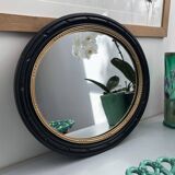 black and gold oval mirror