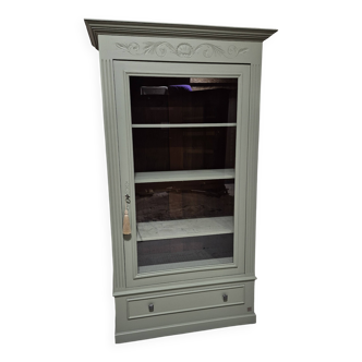 Glass display cabinet with drawer