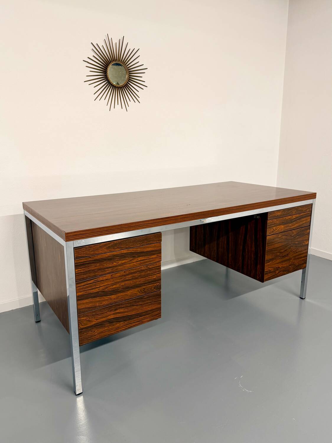 Vintage desk with rosewood veneer and chrome metal design from the 1970s.