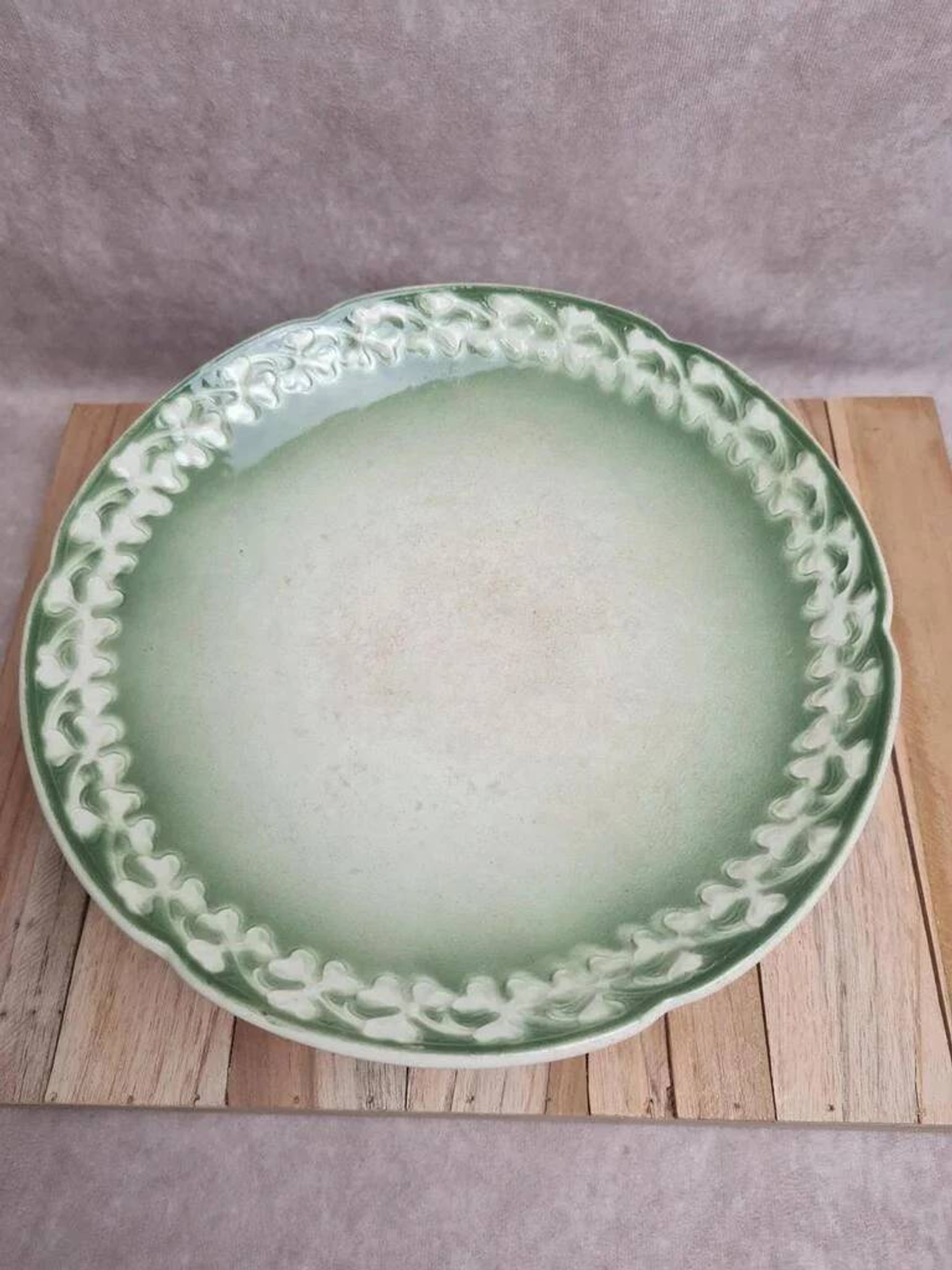 Antique compote stand Lunéville St Clément with green clover decoration.