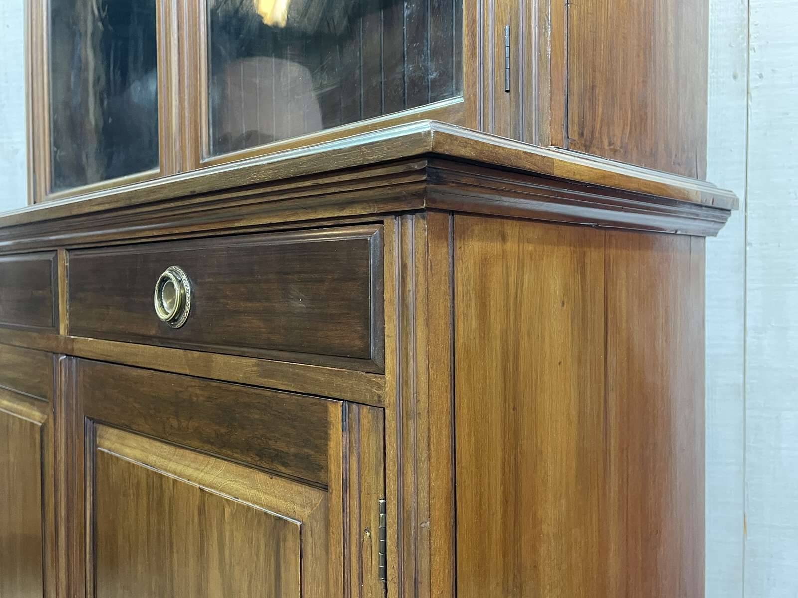 English walnut two-body library from the early 20th century.