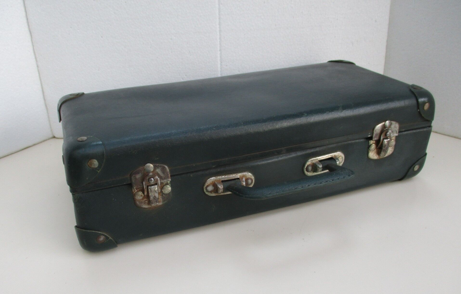 Vintage green cardboard suitcase