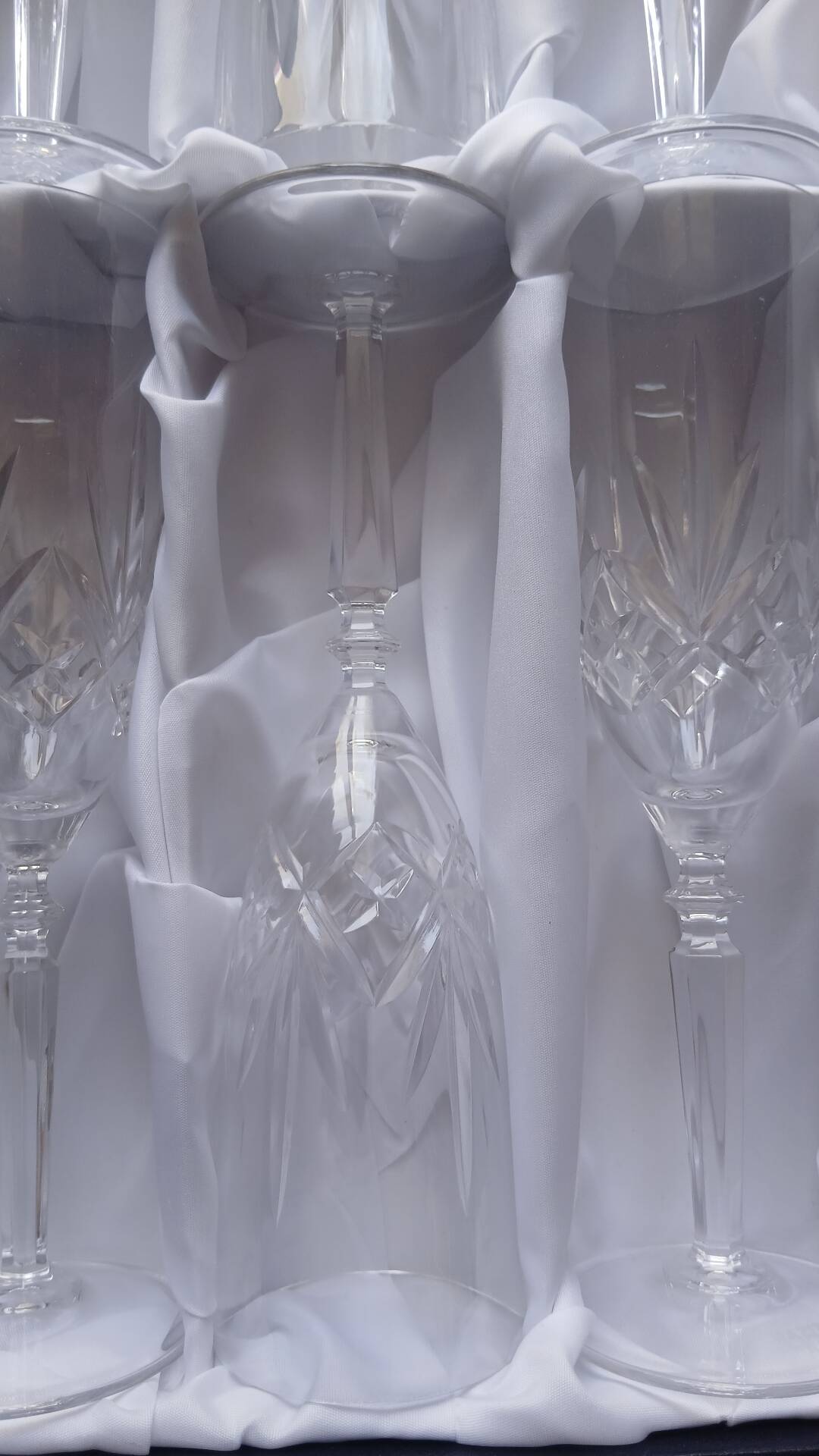 6 crystal champagne flutes from Lorraine Walsheid in their case.