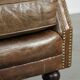 Robust cowhide armchair in a beautifully subtle size with a wonderful patina.