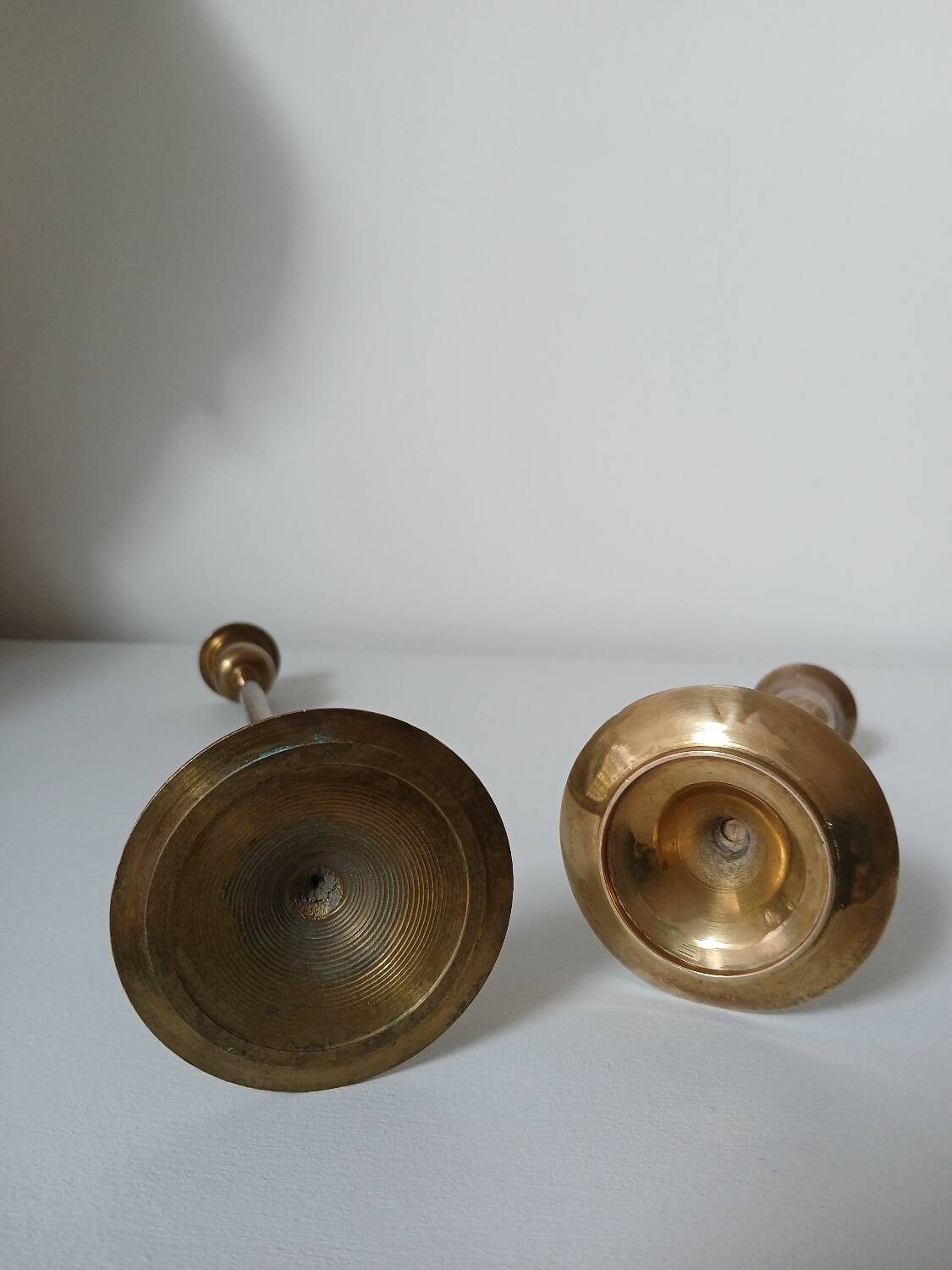 Set of two straight brass candlesticks.