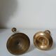 Set of two straight brass candlesticks.