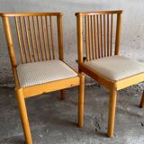 Set of 4 Scandinavian light wood dining chairs with beige polyester upholstered seats