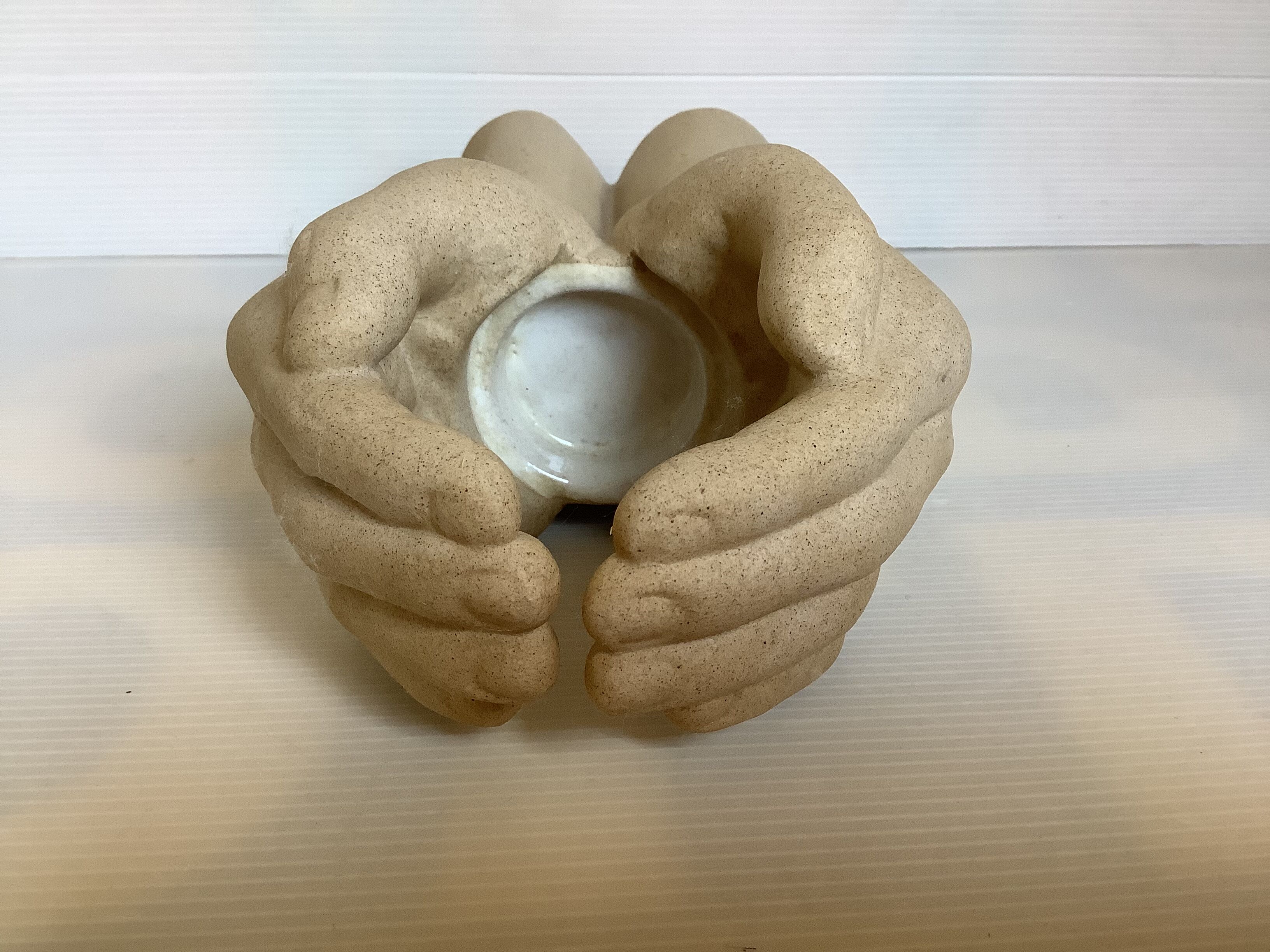 Hand-shaped candle holder