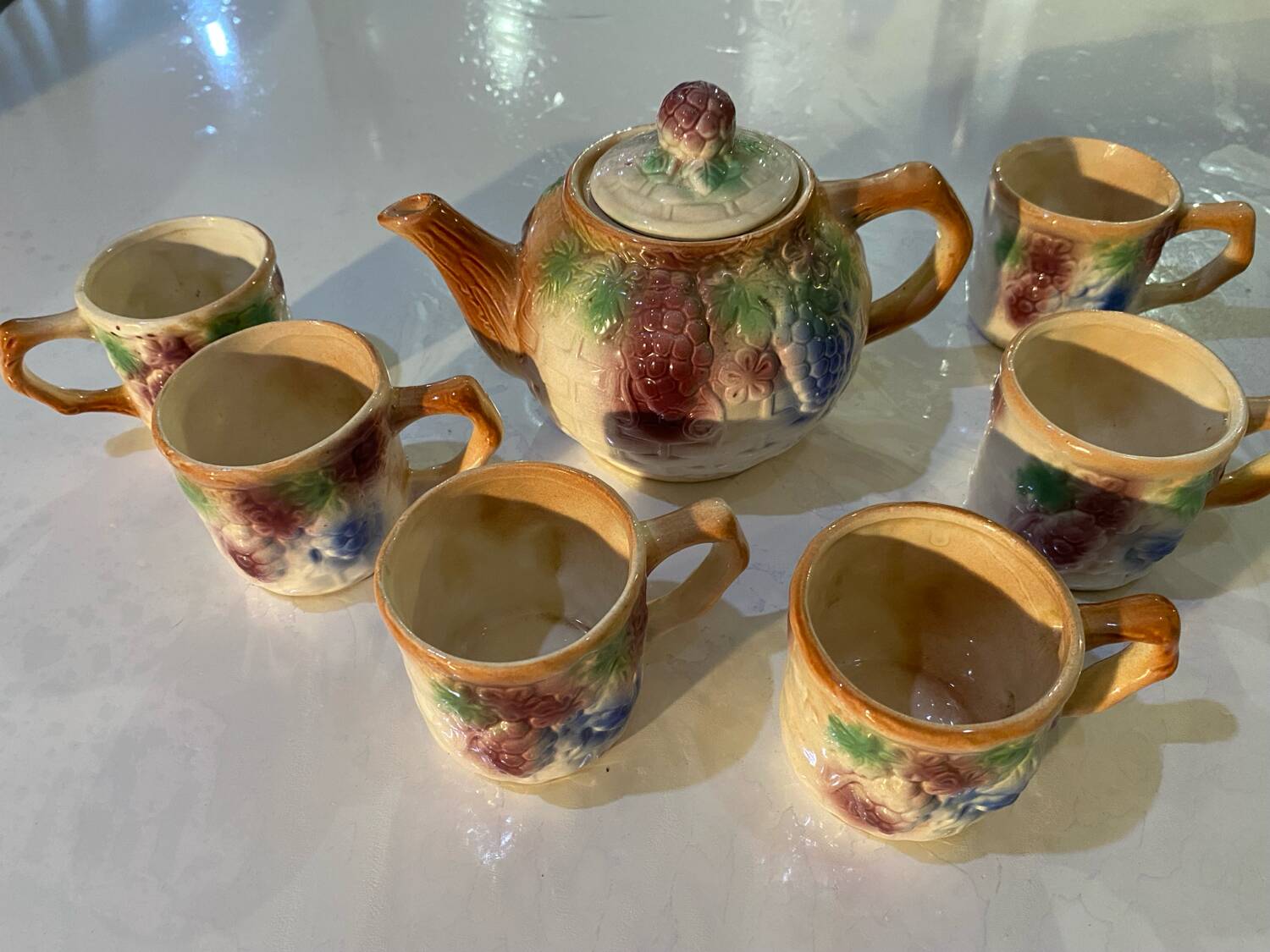 Vintage earthenware teapot and cup set