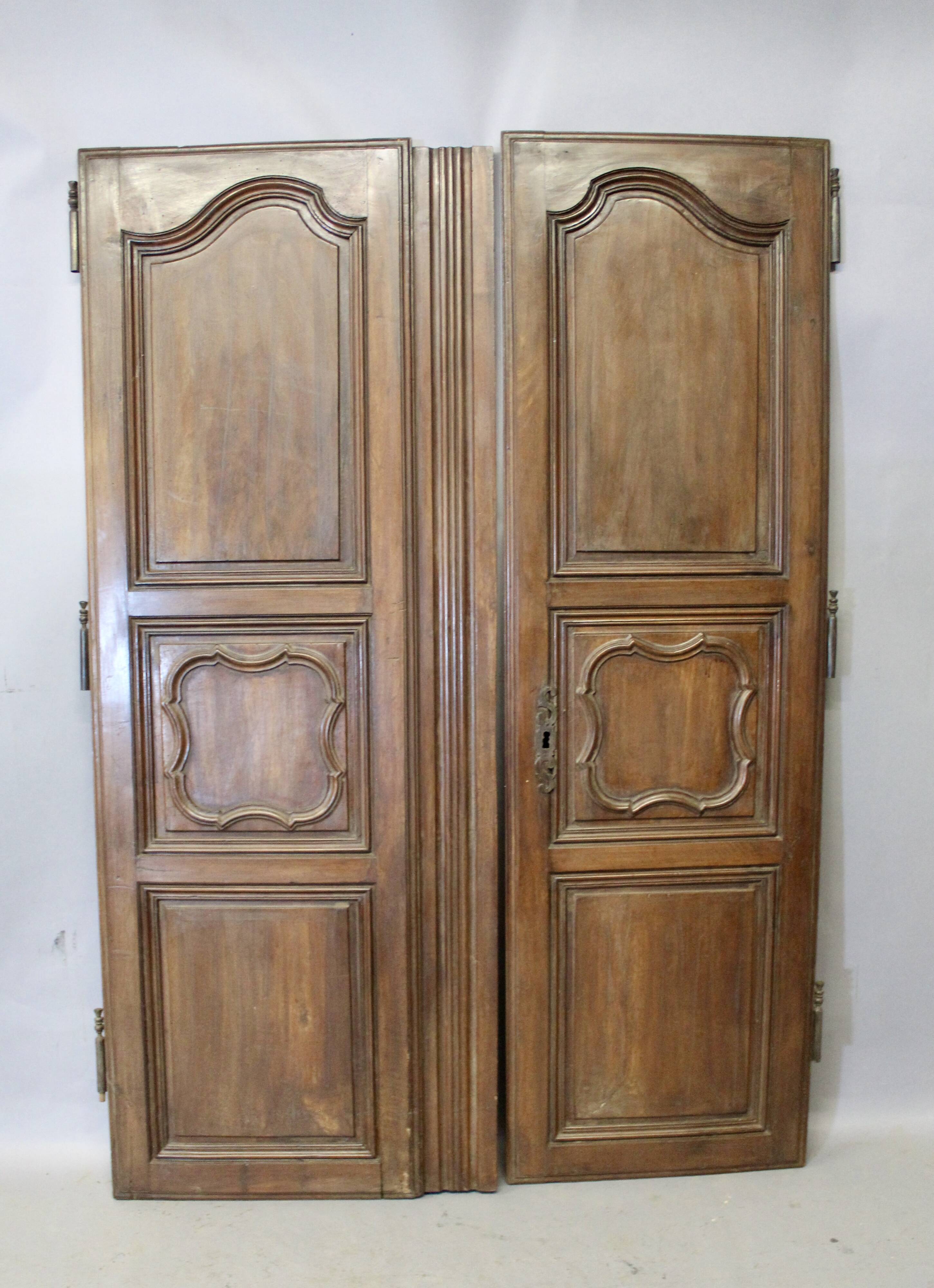 Pair of Louis XV walnut doors with medallion