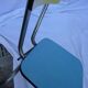 Two chairs and a yellow and blue stool in formica