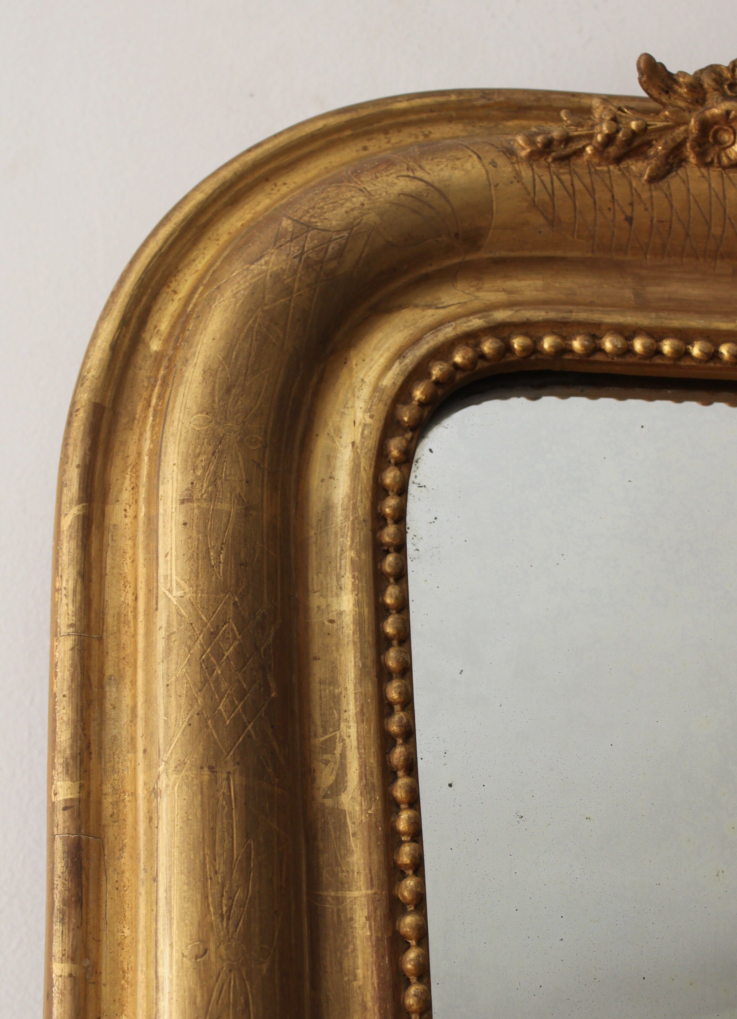 Old gilded mirror with A pediment