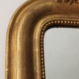 Old gilded mirror with A pediment