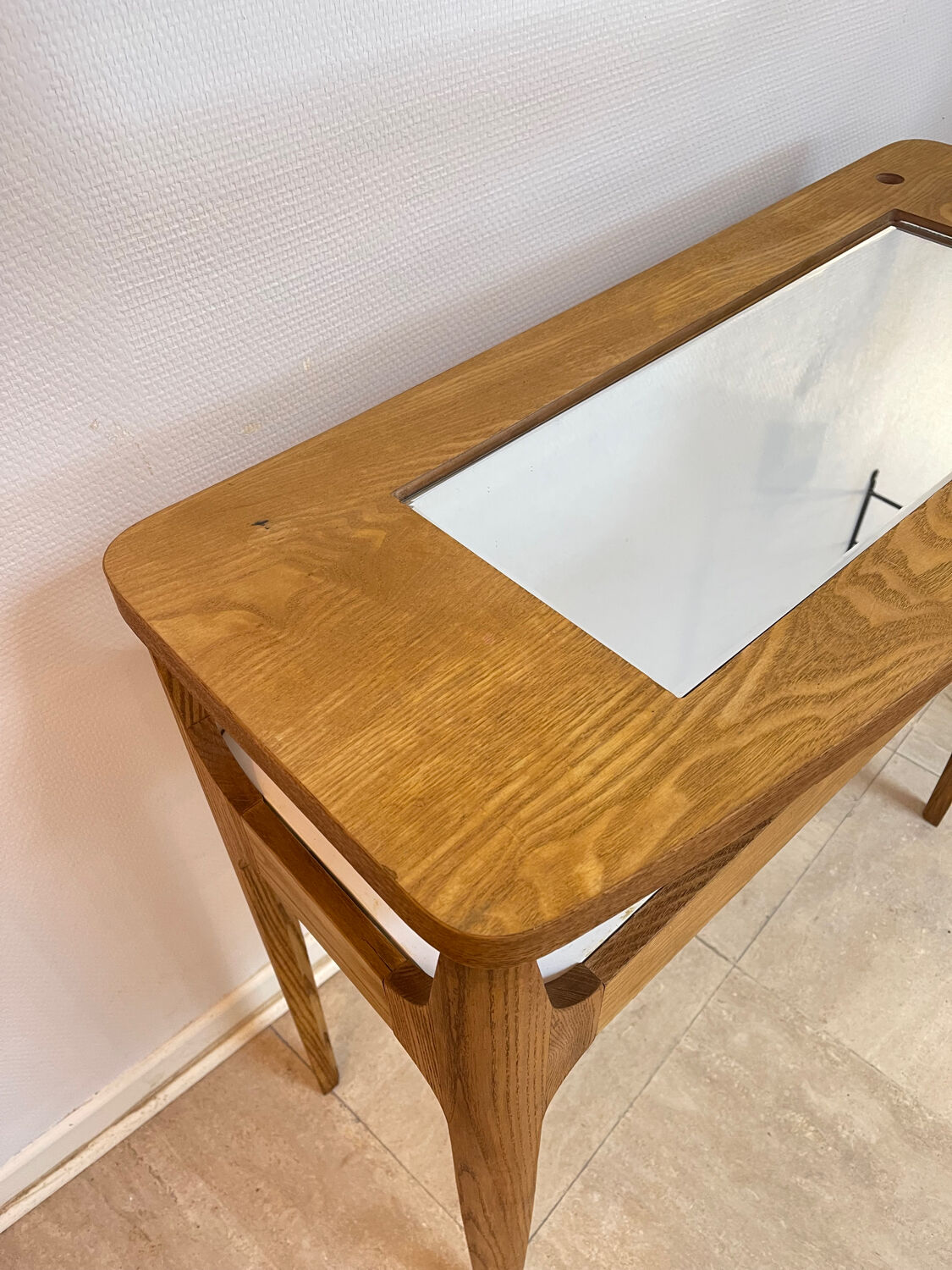Small contemporary console in stained walnut wood.