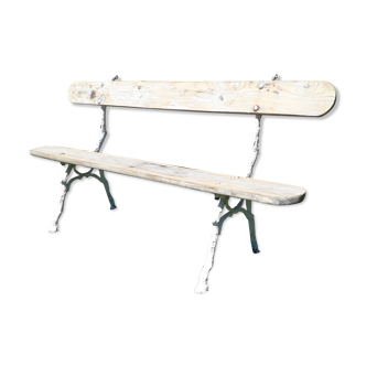 Garden bench with old cast iron foot