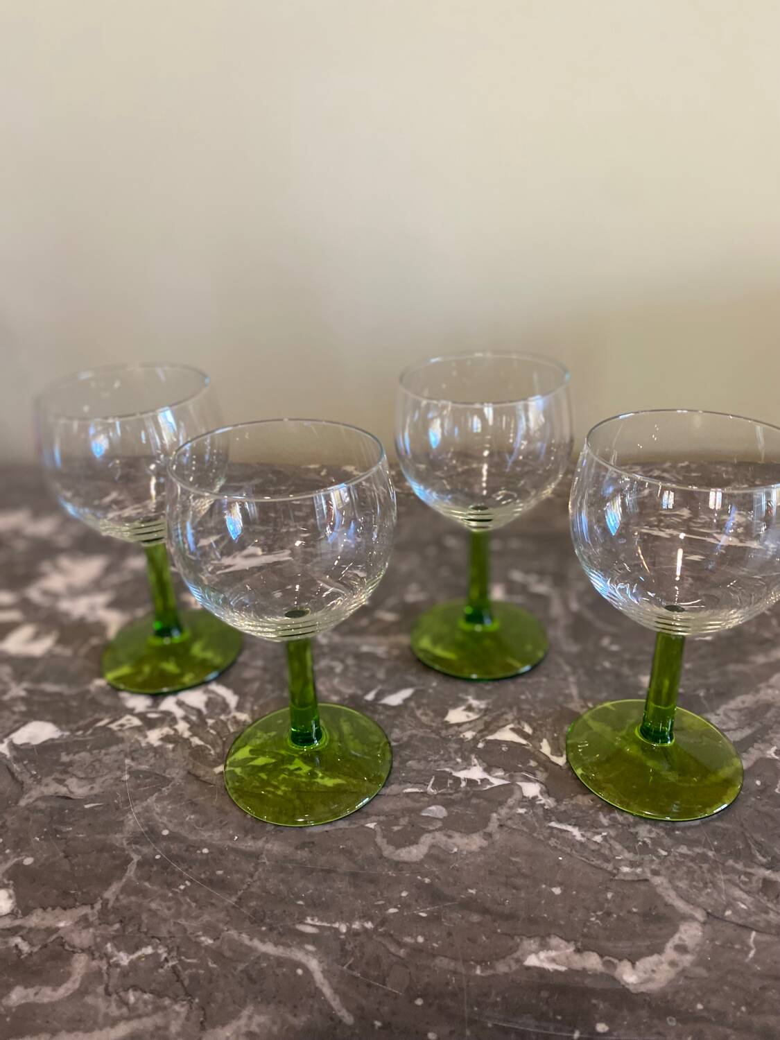 4 green stemmed glasses