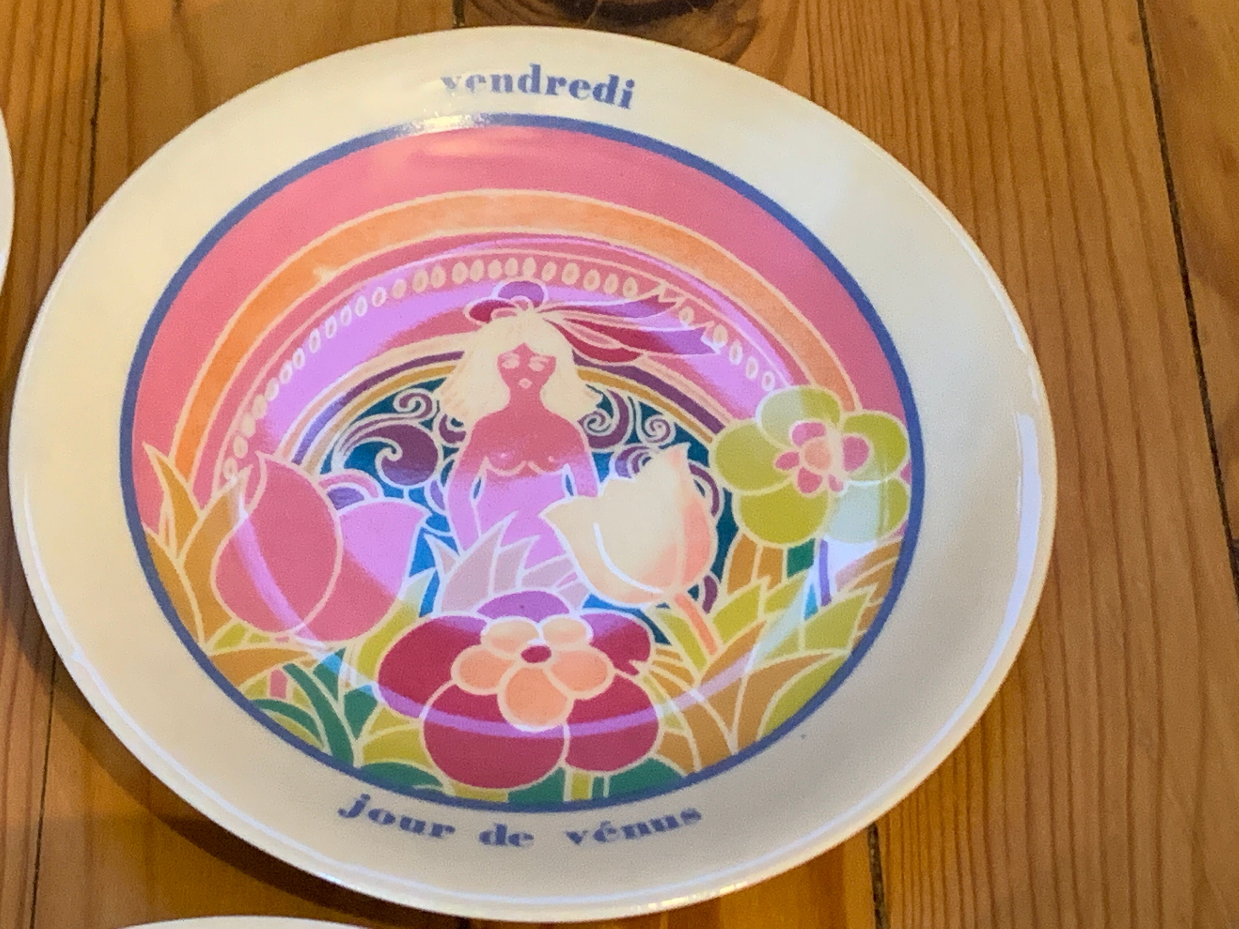 Flat colored porcelain plate, day of the week