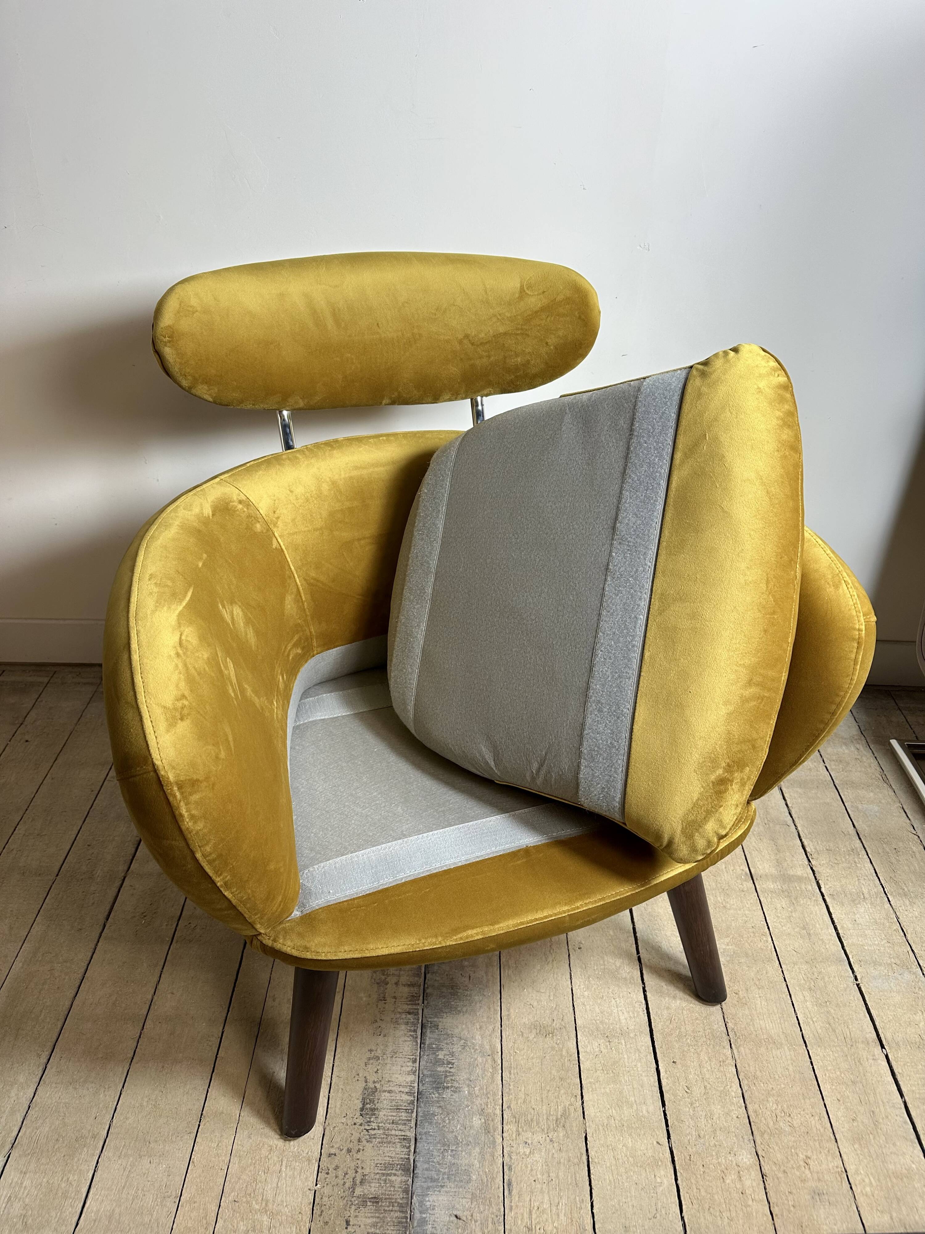 Mustard yellow velvet armchair from the 2010s.