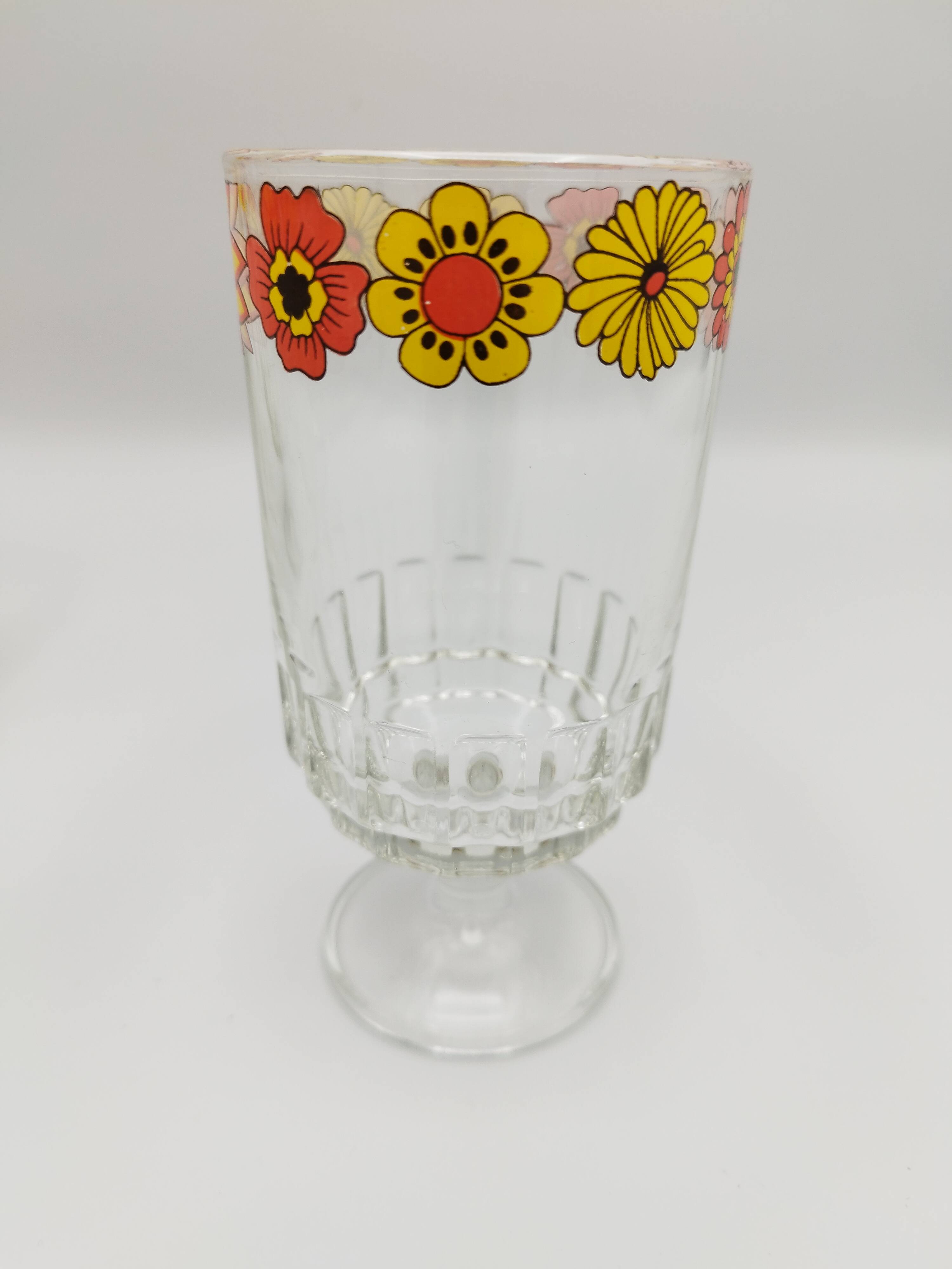 Vintage stemmed glass with floral decoration