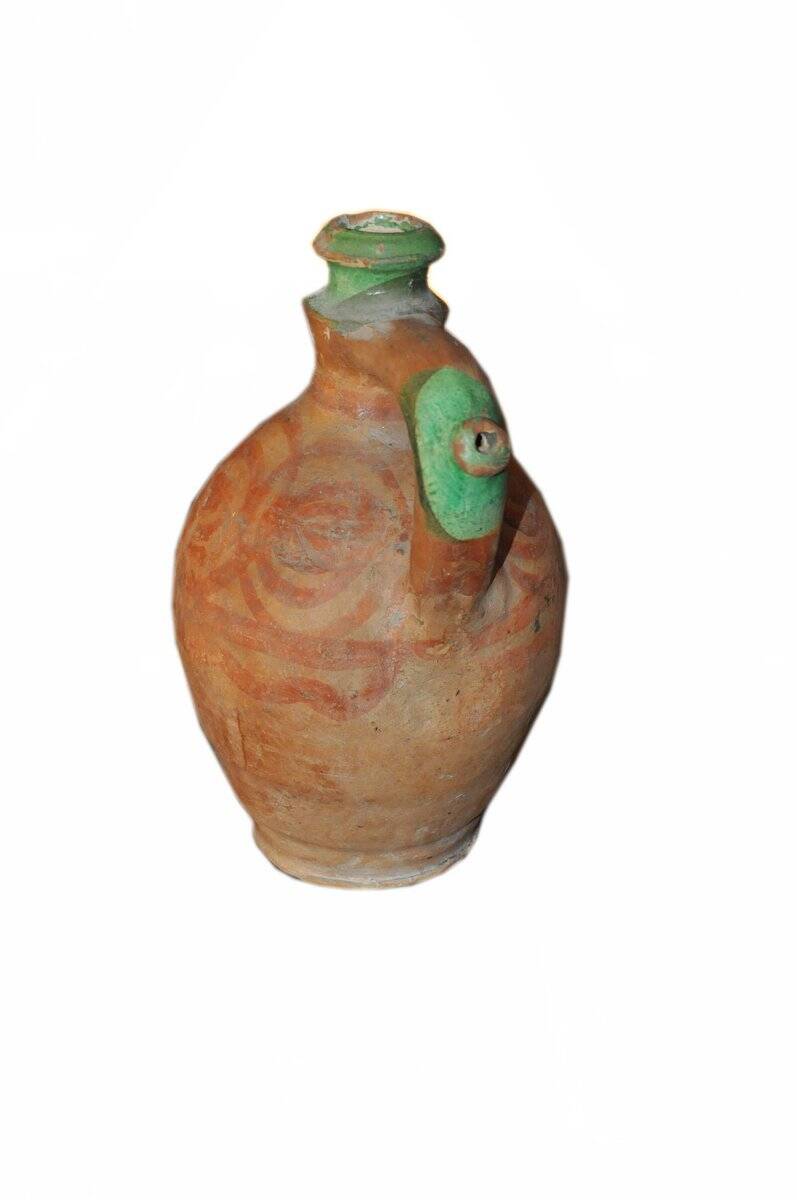 Antique red and green terracotta carafe, rustic Hungarian jug from the 1920s.