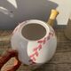 Teapot in white ceramic baseball